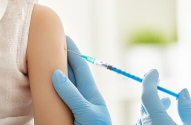 Hybrid polymer nanocarriers enable efficient inhaled mRNA vaccine delivery to the lungs